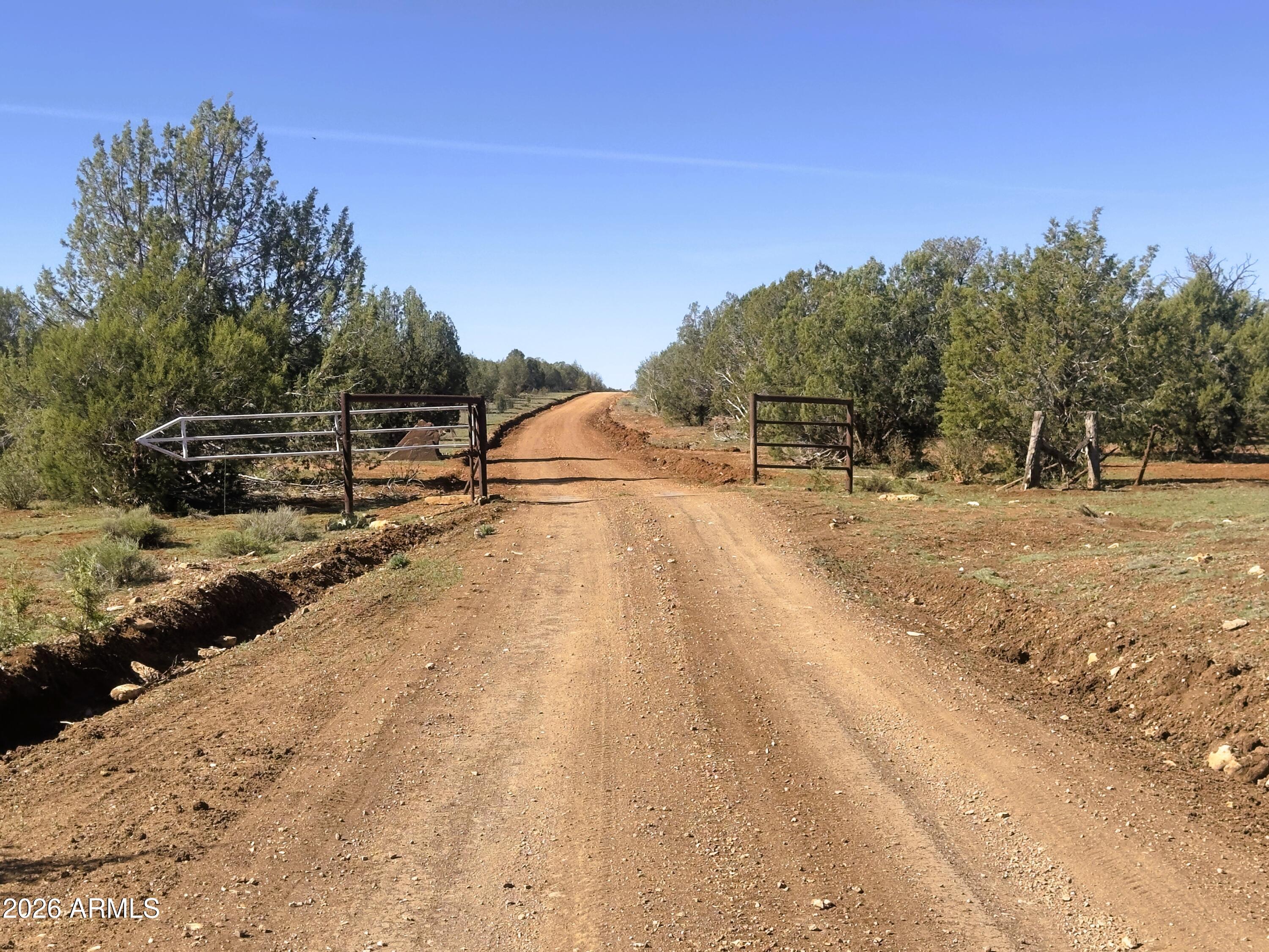 15723 High Tank Road Williams, AZ 86046 - Photo 9 of 18 a view of a yard with wooden fence