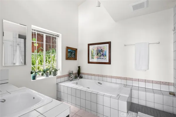 a bedroom with a bed and a cabinets