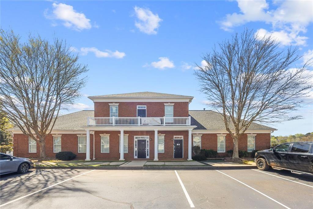 3440 Blue Springs Road, Unit 103 Kennesaw, GA 30144 - Photo 1 of 12 a front view of a building with a street