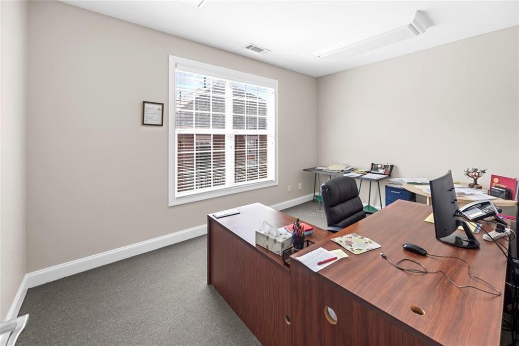 3440 Blue Springs Road, Unit 103 Kennesaw, GA 30144 - Photo 8 of 12 a work room with furniture and a window