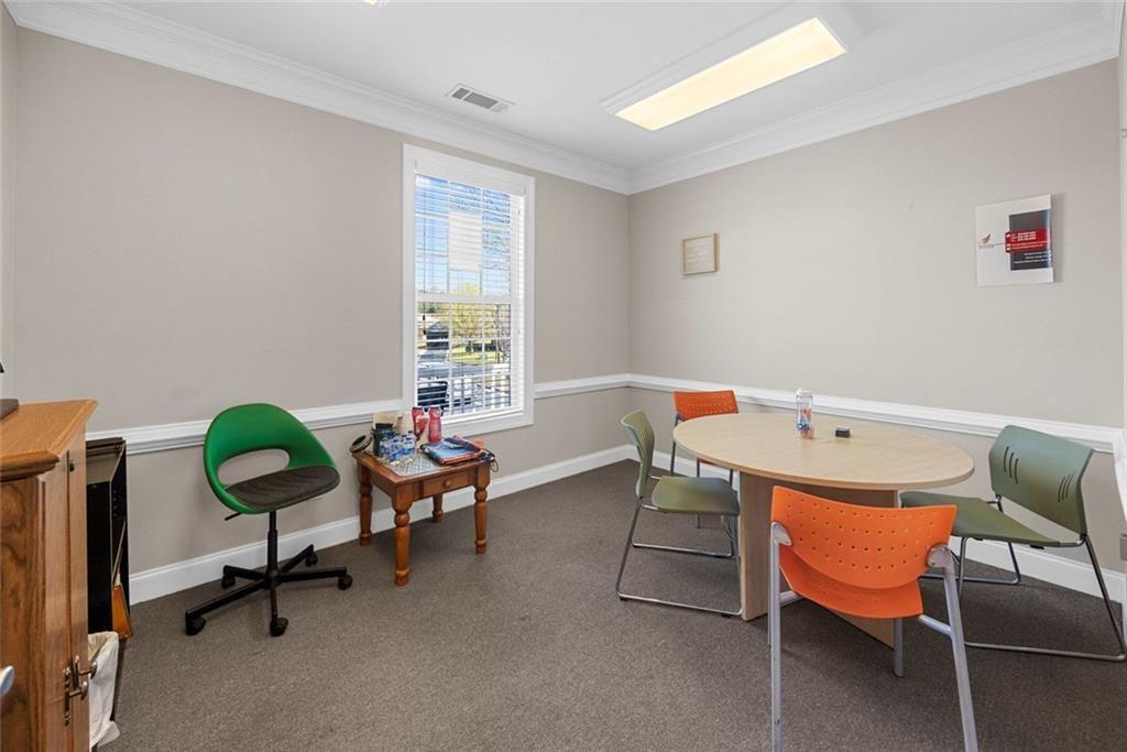 3440 Blue Springs Road, Unit 103 Kennesaw, GA 30144 - Photo 9 of 12 a reading room with furniture and a window
