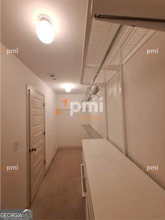 a view of a hallway with closet
