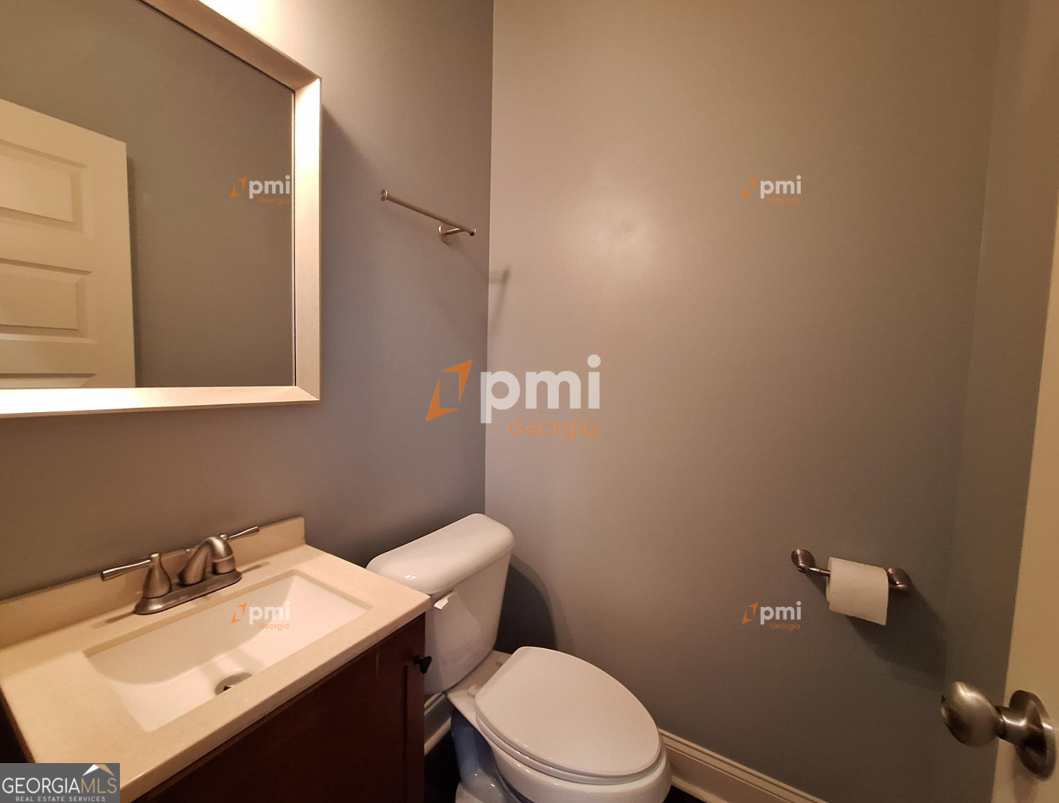 2449 Boulder Road Southeast Atlanta, GA 30316 - Photo 15 of 21 a bathroom with a sink vanity mirror and toilet