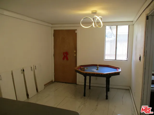 a view of a room with a table and chair