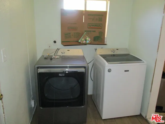 a utility room with a sink washer and dryer