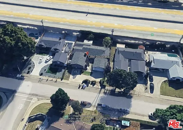 a view of living room with furniture and floor to ceiling window