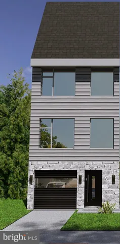 a front view of a house with a garden and garage