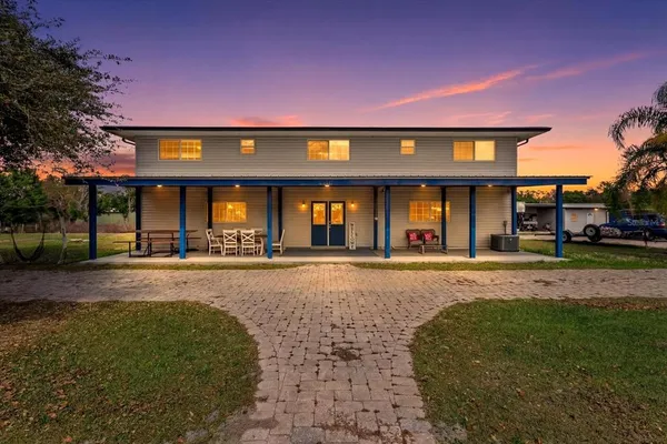 front view of a house with a yard