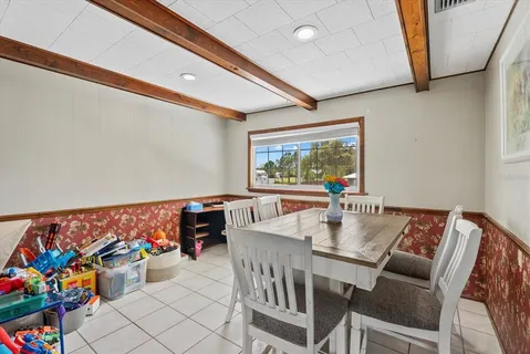a kitchen with stainless steel appliances granite countertop a sink window and cabinets