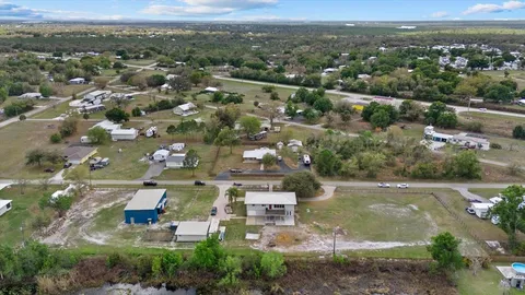 a view of house with yard and entertaining space