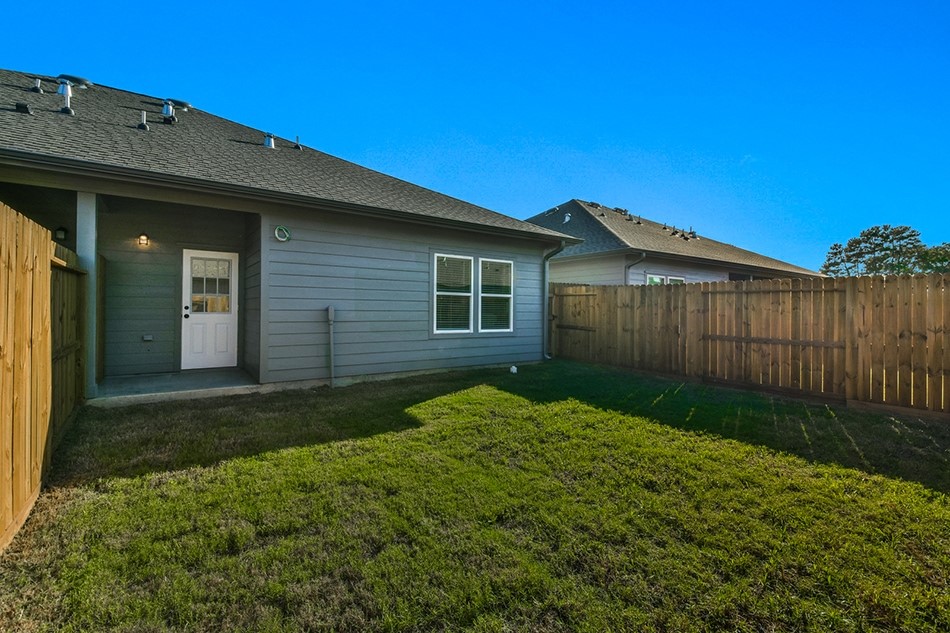 24094 Sears Lane, Unit 13 Porter, TX 77365 - Photo 2 of 11 a backyard of a house
