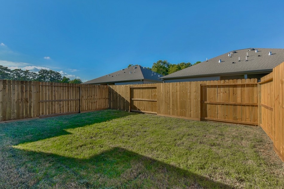 24094 Sears Lane, Unit 13 Porter, TX 77365 - Photo 3 of 11 a view of a backyard with a garden