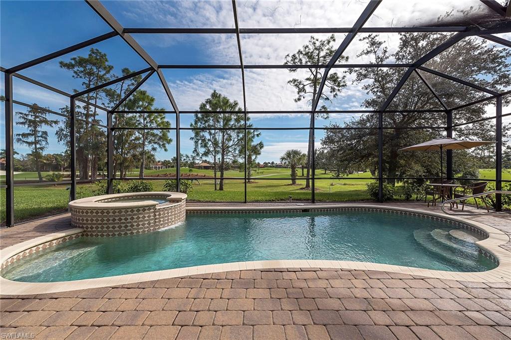 7812 Valencia Court Naples, FL 34113 - Photo 12 of 12 a view of a swimming pool with a patio
