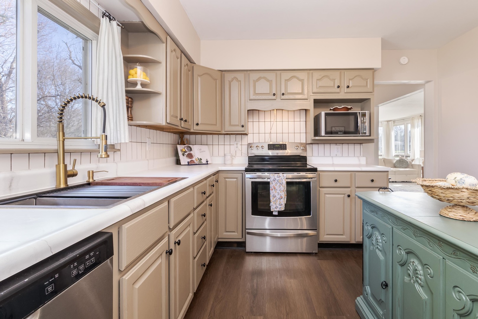 309 North Oak Street Toluca, IL 61369 - Photo 3 of 69 a kitchen with white cabinets stainless steel appliances and sink