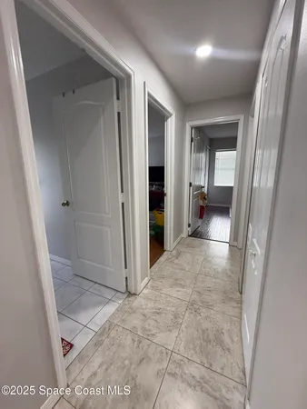 wooden floor with a bathroom
