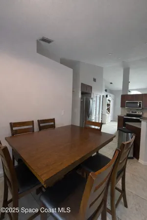 a view of a dining room with furniture