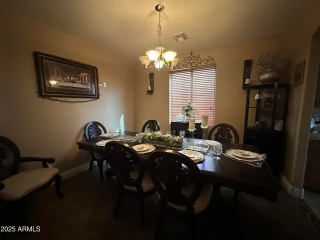 an empty room with windows and cabinet
