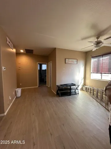 a view of a hallway with windows