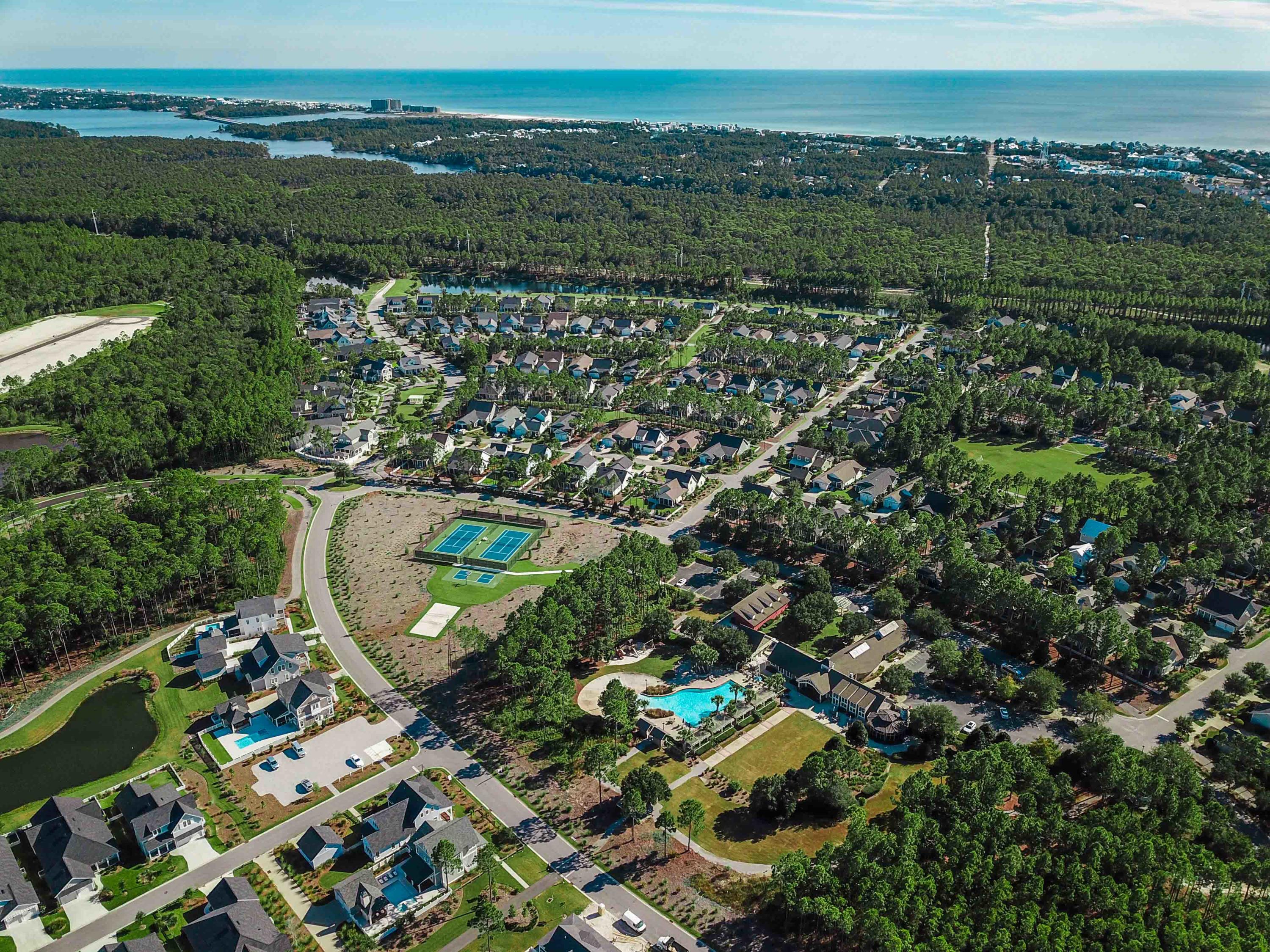 137 Sidecamp Road, Unit LOT 50 Watersound, FL 32461 - Photo 18 of 26 an aerial view of a residential houses with outdoor space and trees