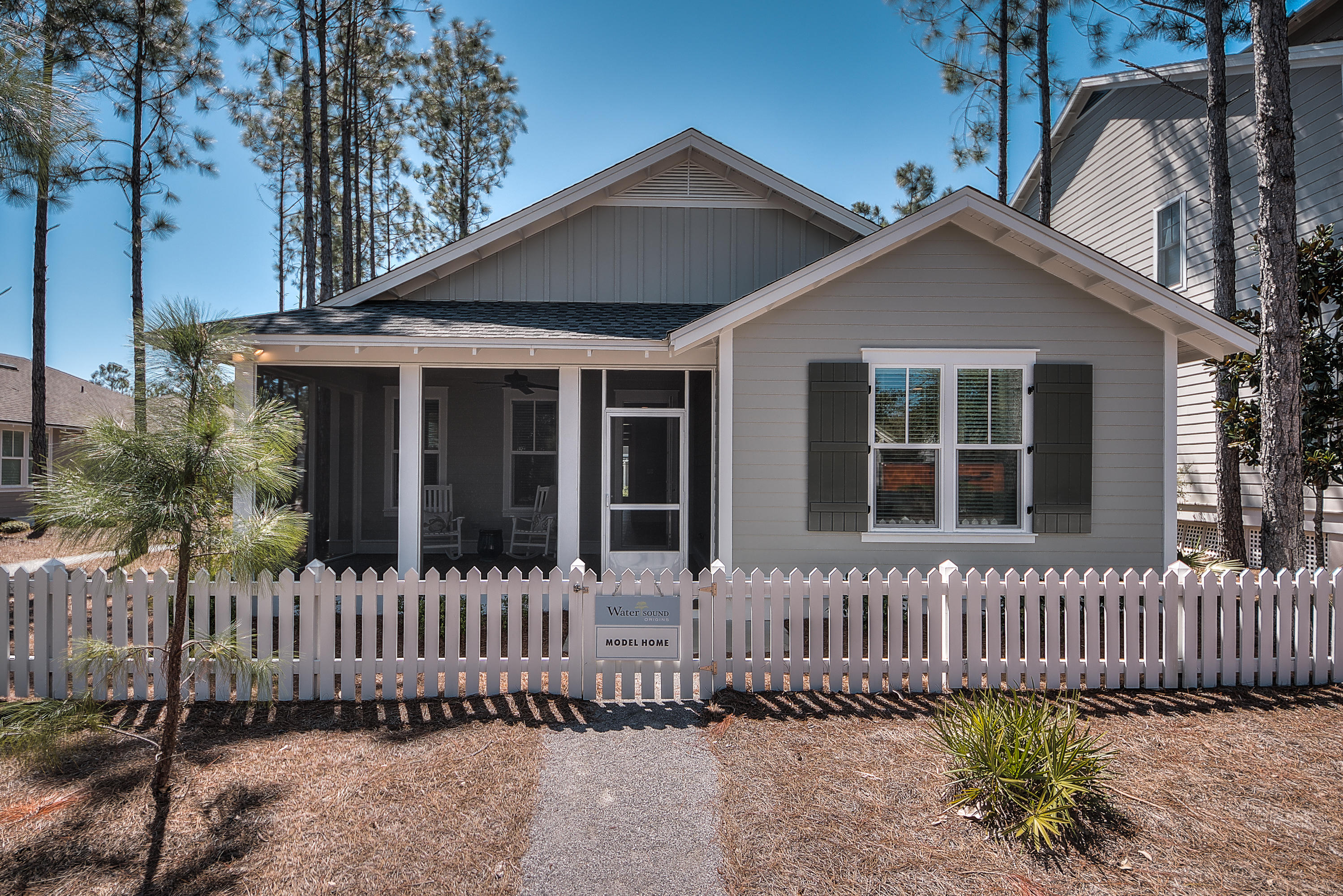 137 Sidecamp Road, Unit LOT 50 Watersound, FL 32461 - Photo 4 of 26 front view of a house with a small yard
