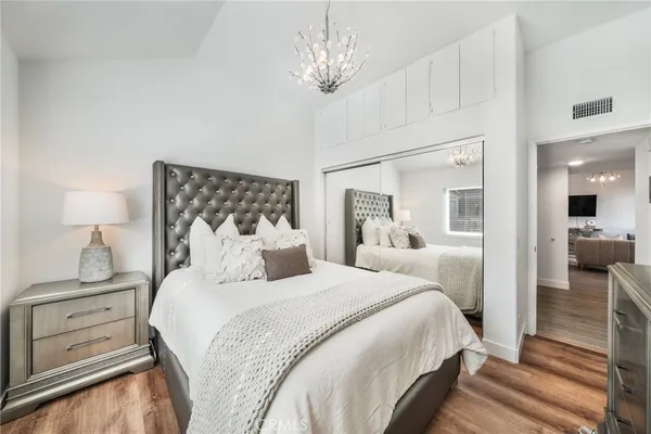 a bedroom with a bed and a view of bedroom