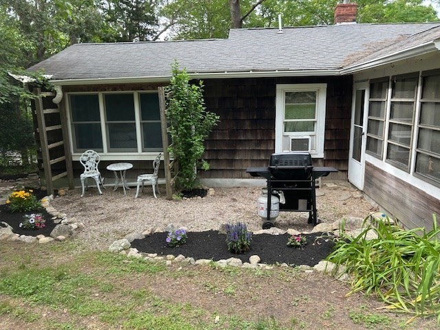 45 Moco Road Barnstable, MA 02668 - Photo 12 of 14 a backyard of a house with outdoor seating