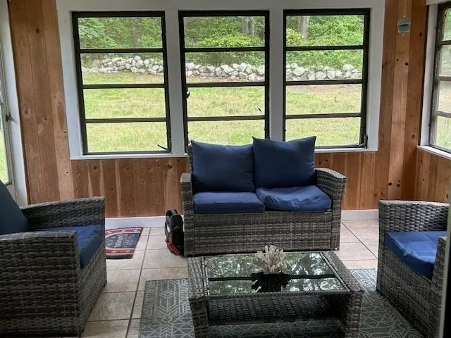 a living room with furniture and a window