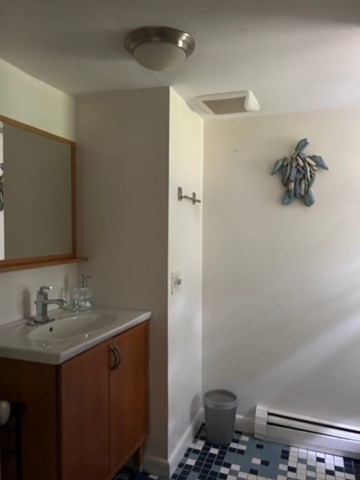45 Moco Road Barnstable, MA 02668 - Photo 7 of 14 a bathroom with a sink and a mirror