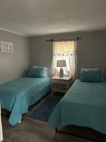 a bedroom with a bed and window