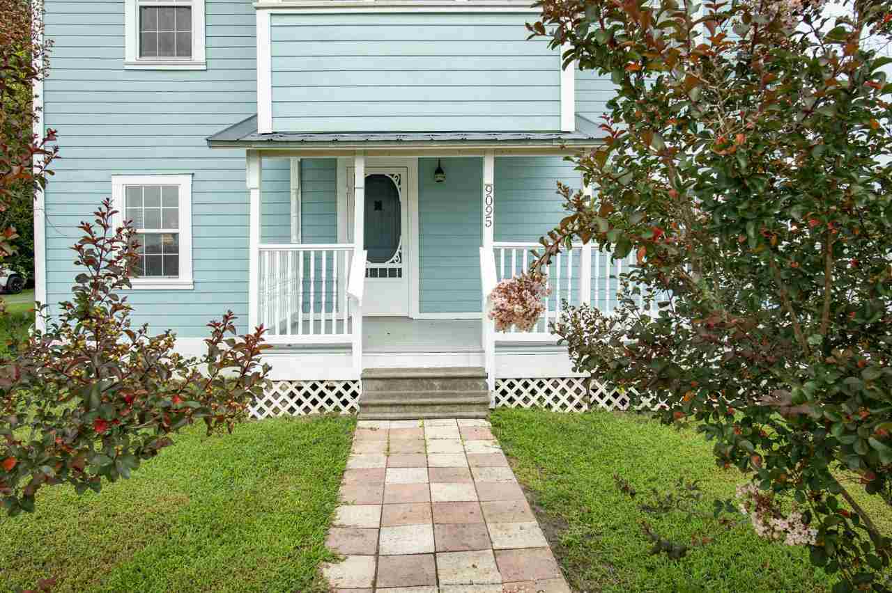 9095 Reid Packing House Road Hastings, FL 32145 - Photo 14 of 50 a front view of a house with a garden