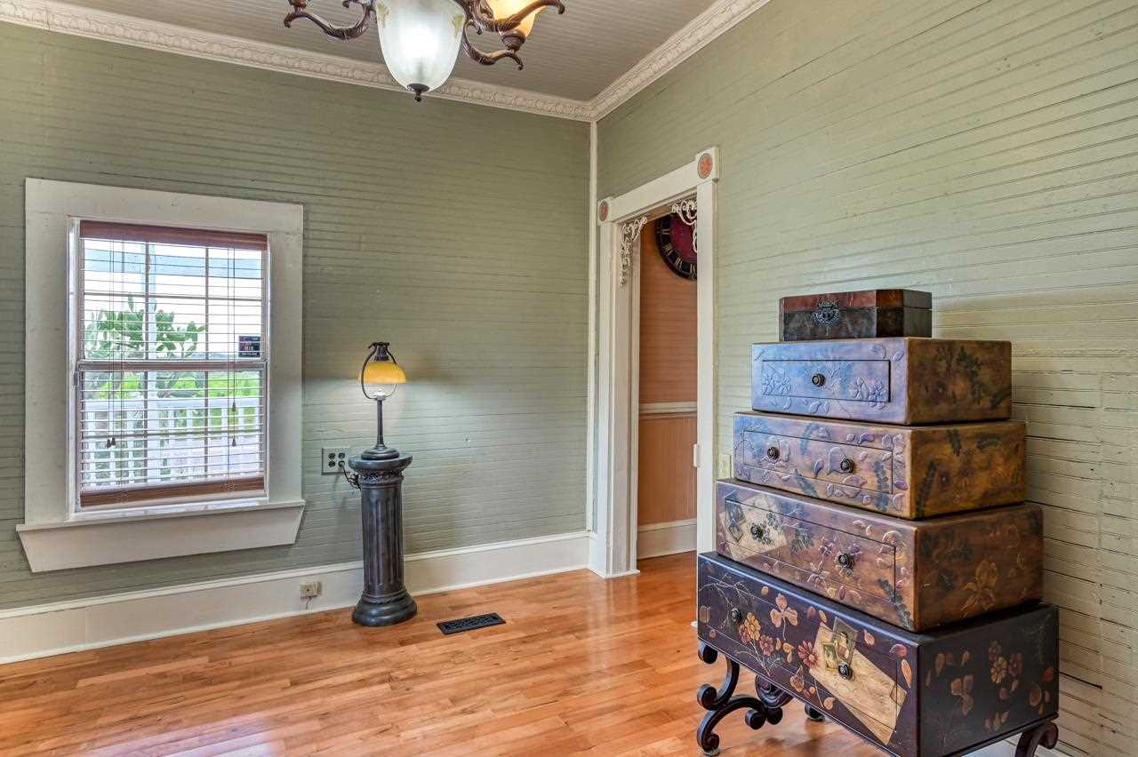 9095 Reid Packing House Road Hastings, FL 32145 - Photo 22 of 50 a view of a bedroom with bed and wooden floor