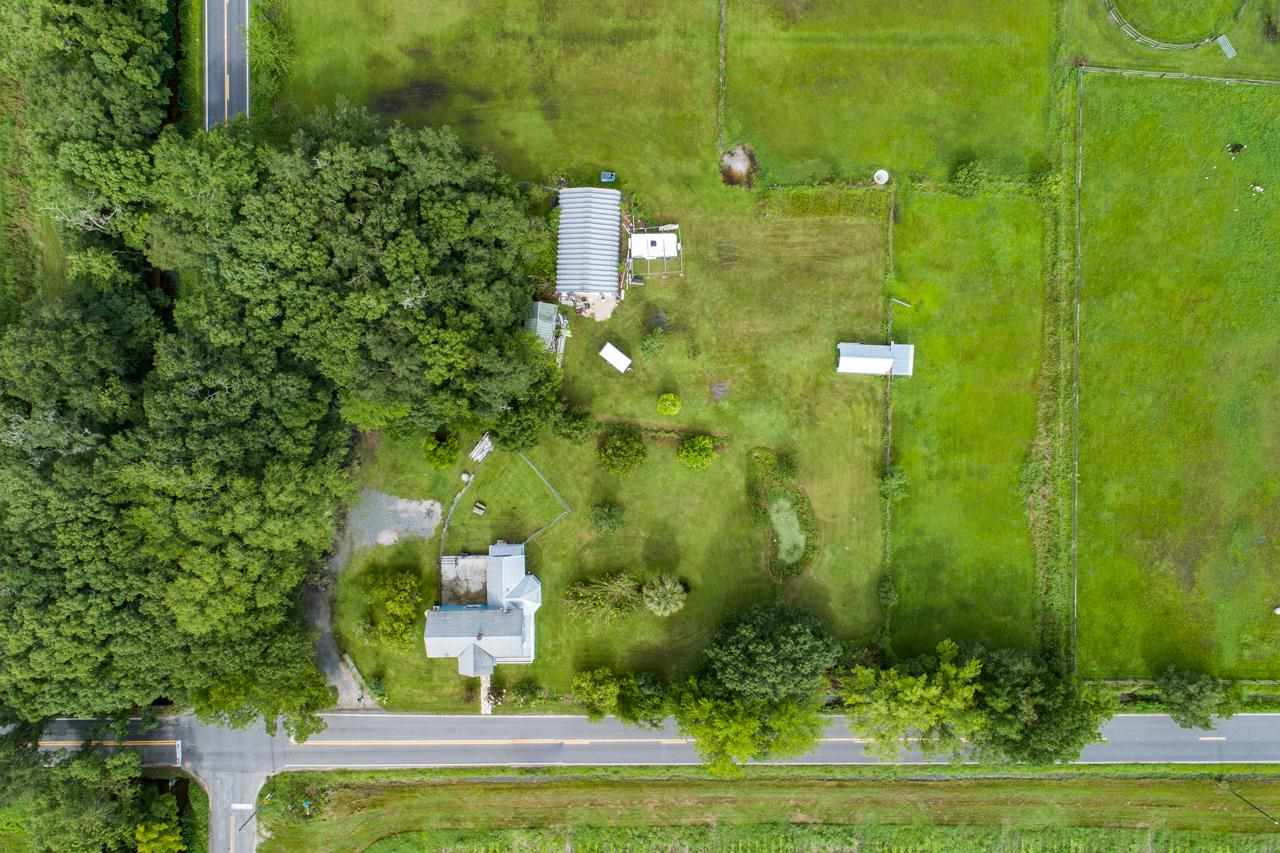 9095 Reid Packing House Road Hastings, FL 32145 - Photo 50 of 50 a view of a multi story residential apartment building with a yard