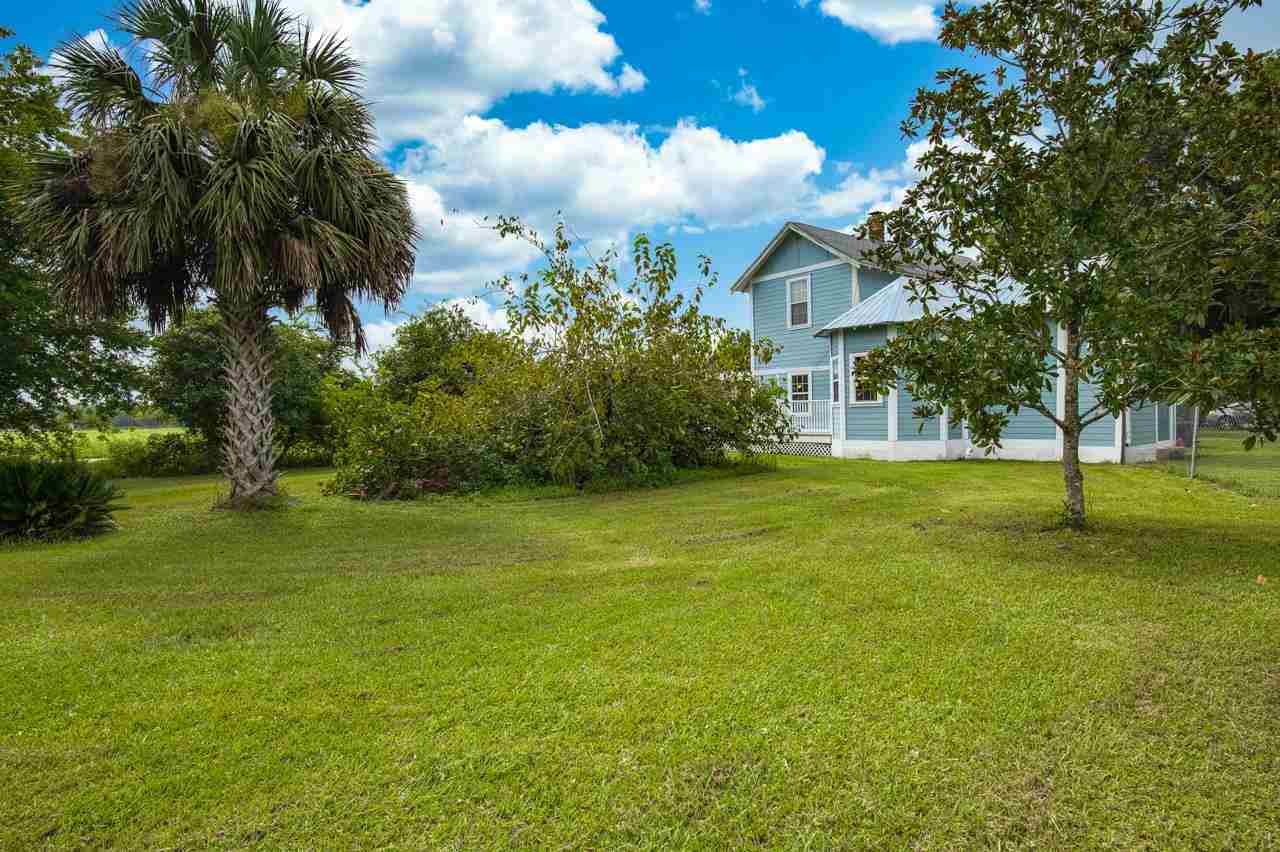 9095 Reid Packing House Road Hastings, FL 32145 - Photo 7 of 50 a view of a yard with a house