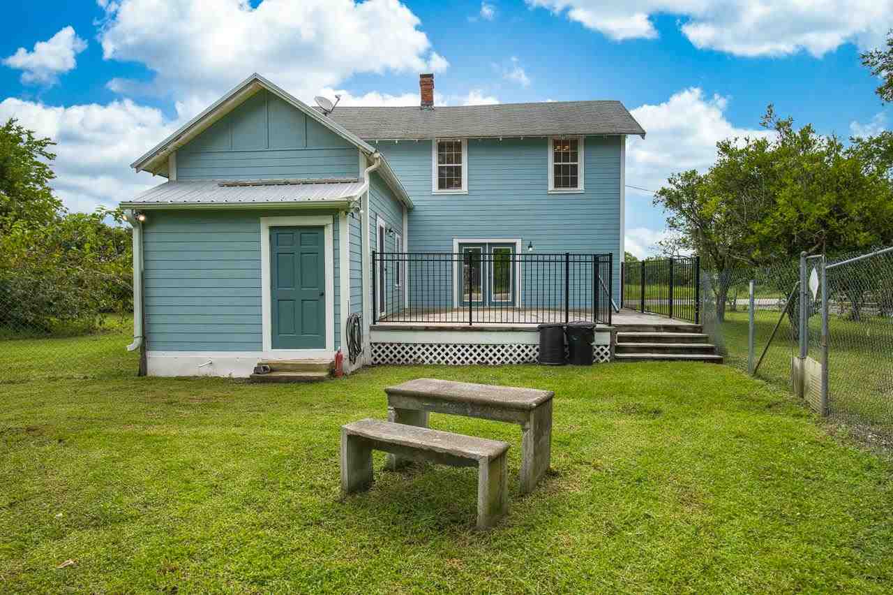 9095 Reid Packing House Road Hastings, FL 32145 - Photo 9 of 50 a view of a house with a backyard