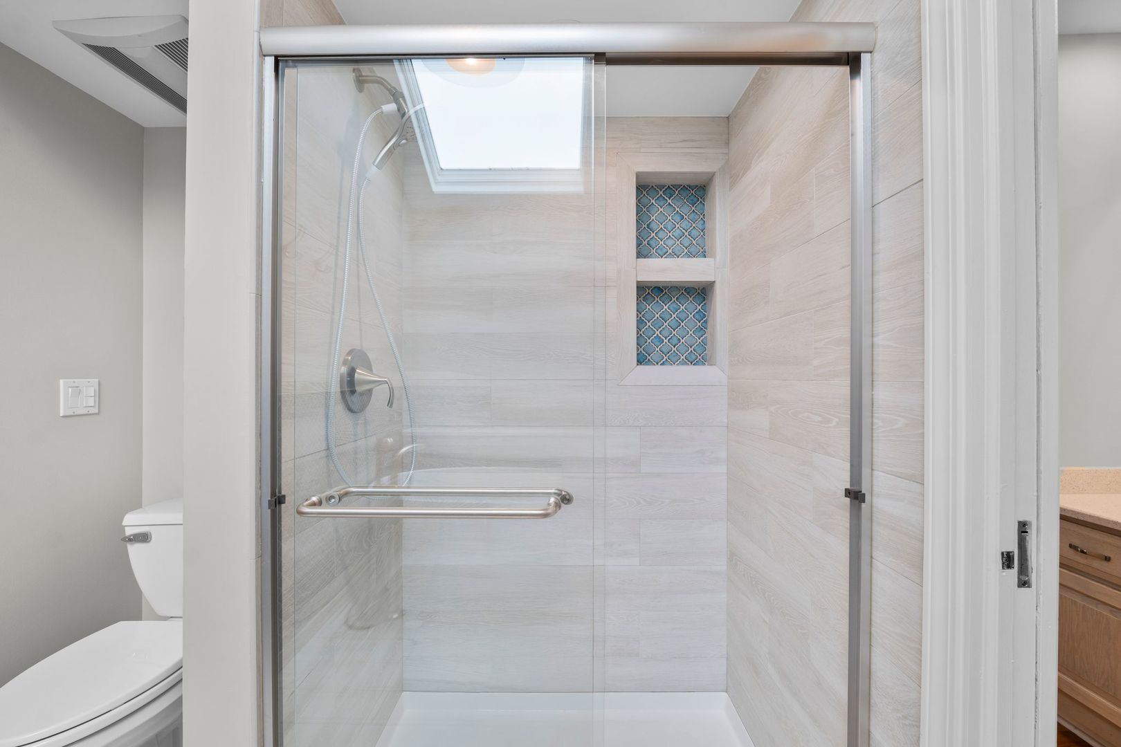 3130 Kayjay Drive Northbrook, IL 60062 - Photo 15 of 23 a bathroom with a glass shower door