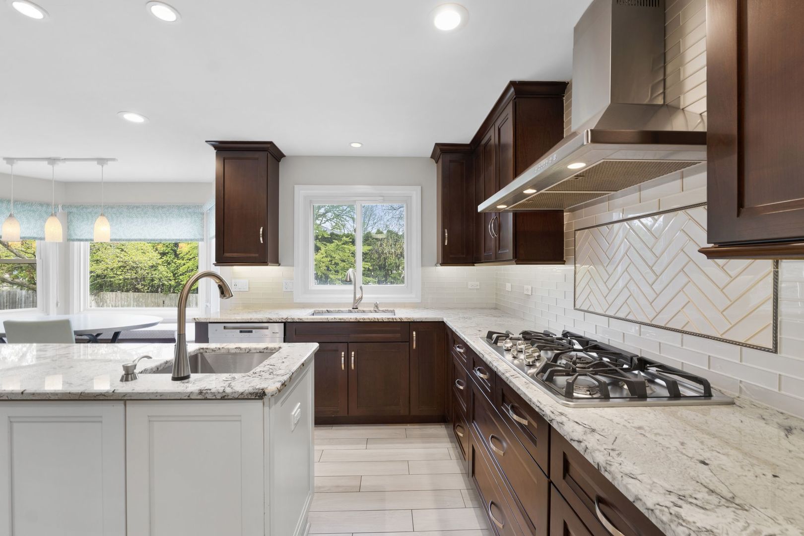 3130 Kayjay Drive Northbrook, IL 60062 - Photo 5 of 23 a kitchen with stainless steel appliances granite countertop a sink stove and cabinets