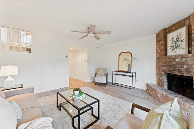 a living room with furniture and a fireplace