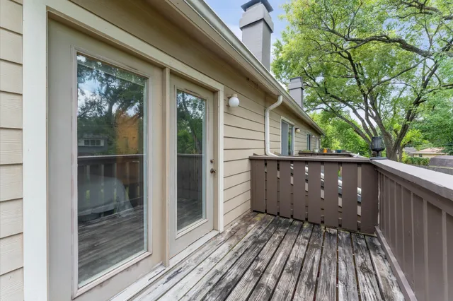 a bedroom with a bed and a ceiling fan