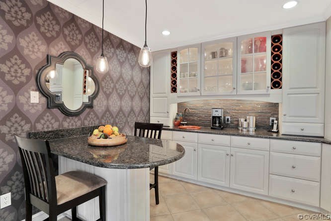 1821 Castlebridge Road Midlothian, VA 23113 - Photo 11 of 40 a kitchen with a sink a stove and a dining table