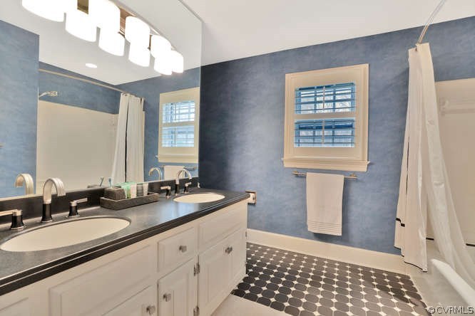 1821 Castlebridge Road Midlothian, VA 23113 - Photo 23 of 40 a bathroom with a sink a vanity and a mirror