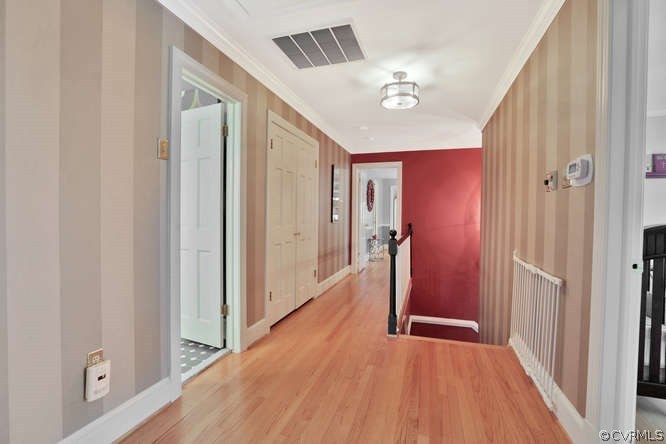 1821 Castlebridge Road Midlothian, VA 23113 - Photo 24 of 40 a view of a hallway with wooden floor and staircase