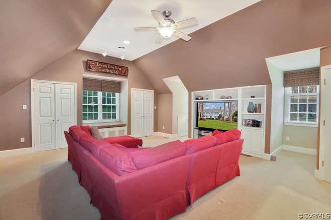 1821 Castlebridge Road Midlothian, VA 23113 - Photo 29 of 40 a living room with furniture two windows and a chandelier
