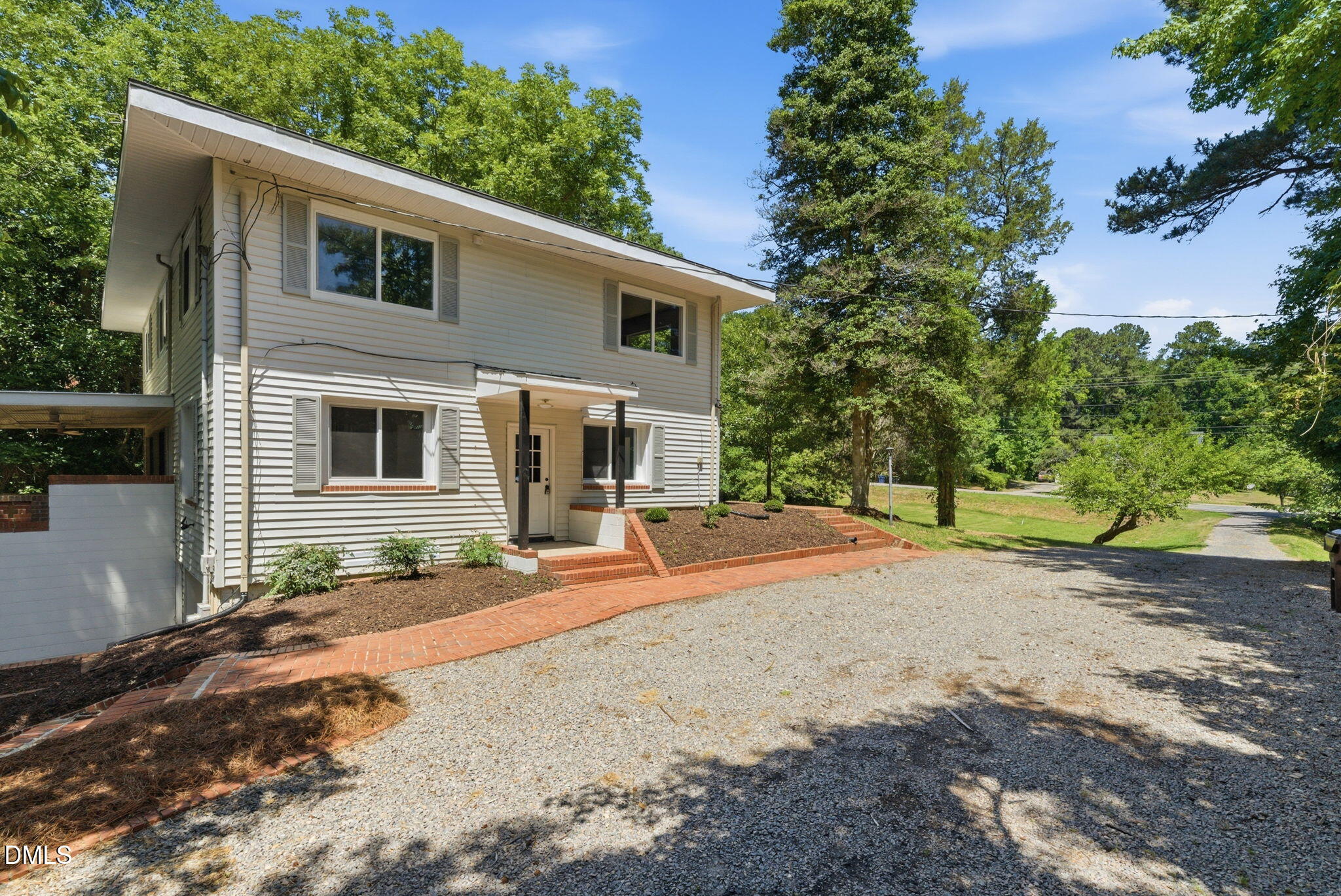 1615 Carbonton Road Sanford, NC 27330 - Photo 4 of 49 a front view of a house with a yard and garage
