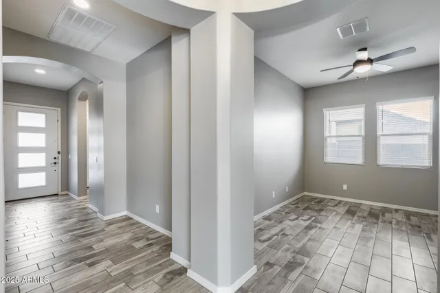 a kitchen with stainless steel appliances granite countertop a stove and a white cabinets