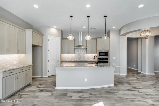 a bathroom with a granite countertop sink mirror and shower