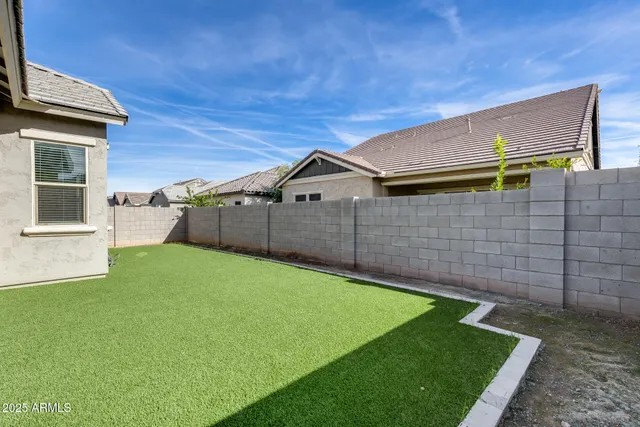 a view of a backyard of the house