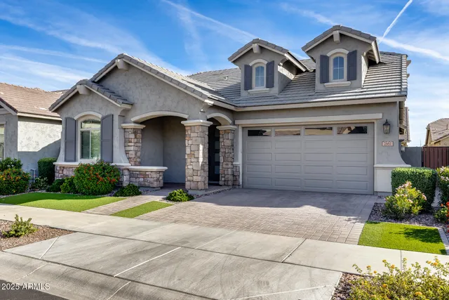an empty room with a window and a ceiling fan