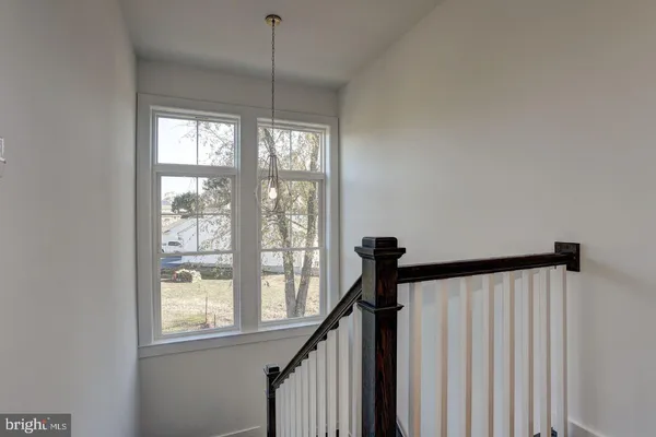 a view of a hallway with windows