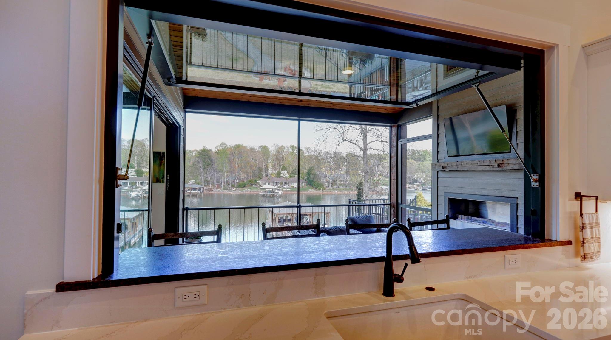644 Normandy Road Mooresville, NC 28117 - Photo 13 of 32 a view of a living room and a floor to ceiling window