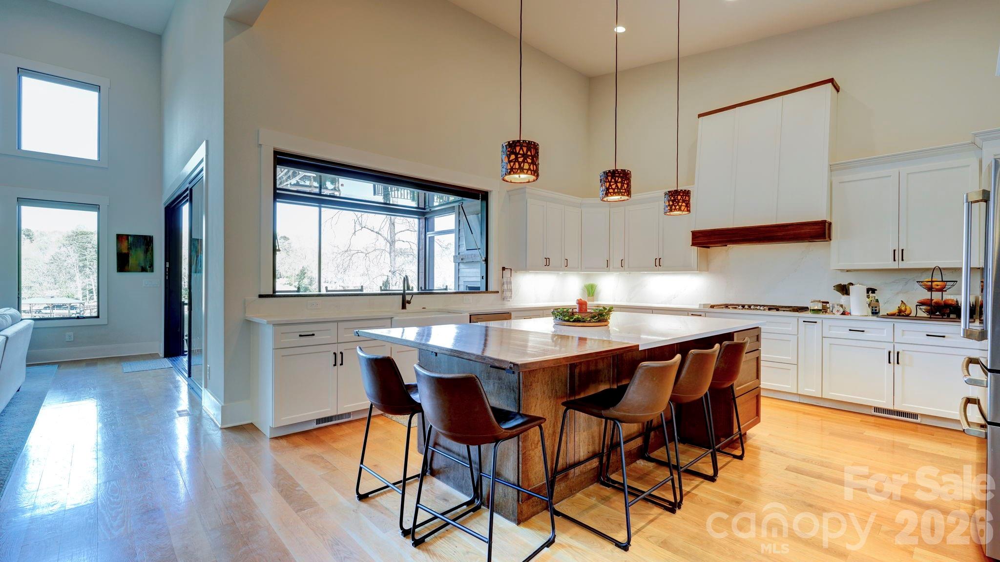 644 Normandy Road Mooresville, NC 28117 - Photo 16 of 32 a kitchen with a table and chairs in it